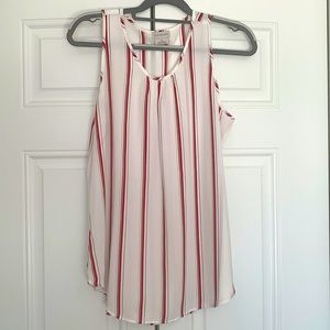 Sleeveless top perfect for layering with a sweater or wear alone.